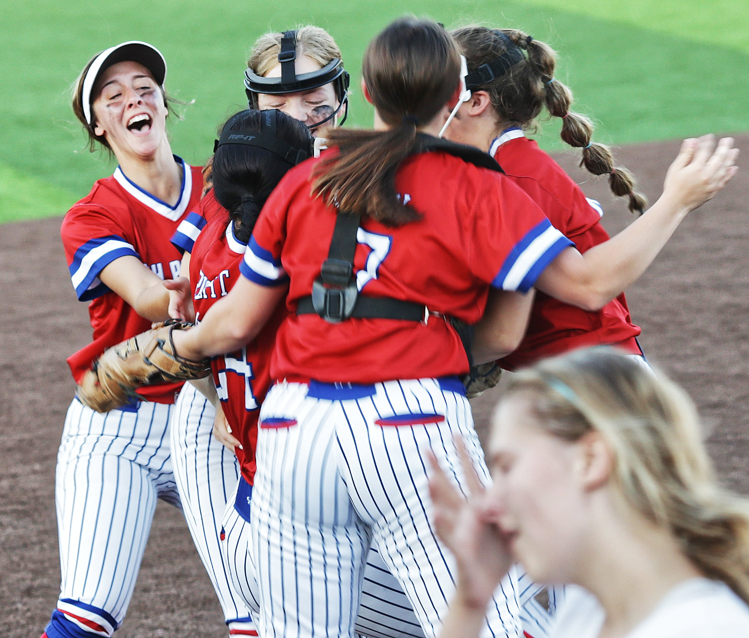 The celebration begins for Alba-Golden’s area softball victory May 7 over Martin's Mill.